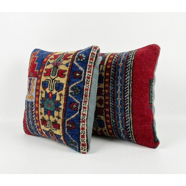 This beautiful 16'' x 16'' pillow cover set was made from authentic Turkish rug pieces. Bright colors of wool adorn the...