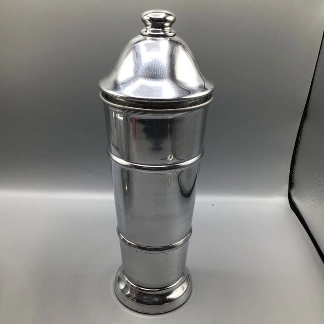Great vintage Italian ice bucket with tongs and large vintage Kraftware cocktail shaker. The Ice bucket measurements are 9...