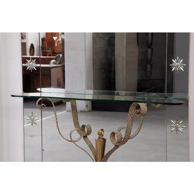 Console with mirror wrought iron gilded, with glass top, the mirror and surrounded by stylized flowers etched in the top...