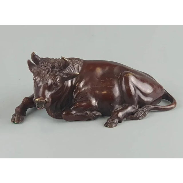 Antique Japanese bronze sculpture of a laying bull, Meiji 19thC