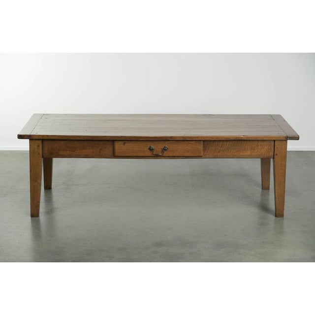 Offered by ByThijs: this very charming antique French coffee table made of walnut wood with a beautiful patina and warm...