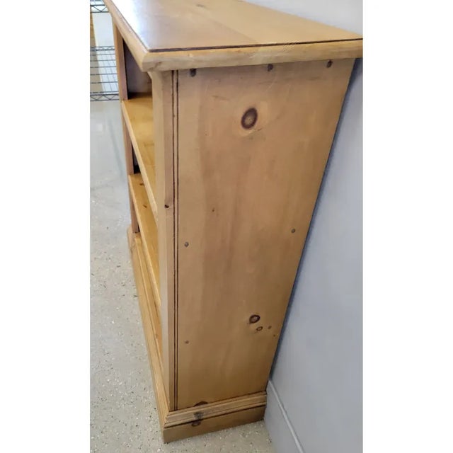 A nice sized 2-shelf waxed pine bookcase. The shelf spacing is 9.25".