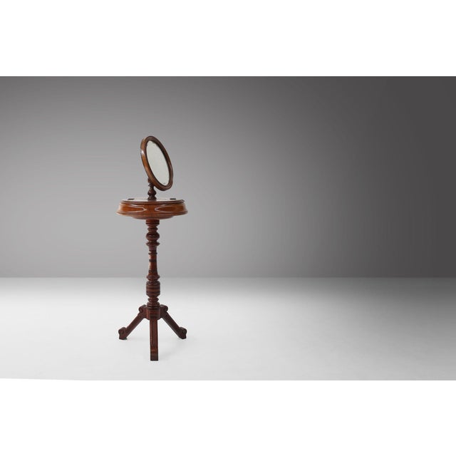 A charming and evocative example of mid‑19th‑century French romantic design, this adjustable make‑up mirror combines...