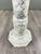Elegant column in white marble veined with gray, featuring an octagonal base and top. The shaft is finely turned in a...