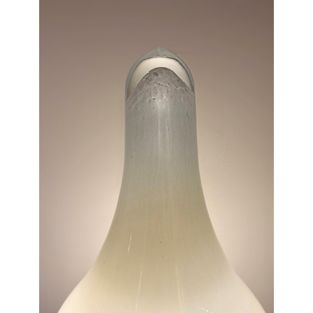 This exceptional set of three hand-blown Murano glass lamps embodies the refined experimental spirit of Italian midcentury...