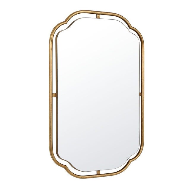 Surrounded by a tubular frame, this "floating mirror" is soften by its concave corners. Finished in a lightly antiqued...