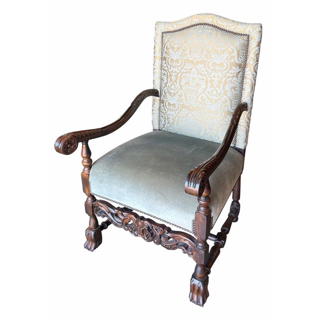 Pair of Italian Baroque Style Carved Walnut Armchairs with damask and velvet upholstery and nail head trim.