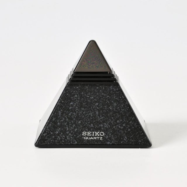 Iconic pyramid-shaped talking clock from Seiko. Made in Japan in the 1980s. German language only! This piece has an...