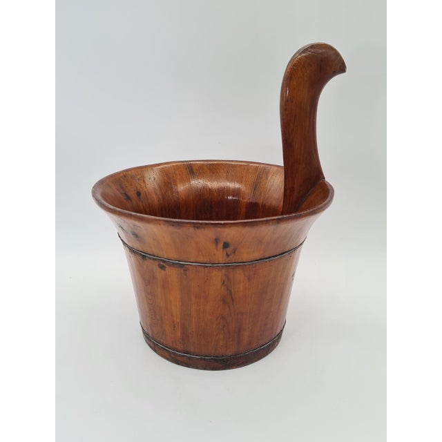 An authentic, handcrafted wooden bucket (utility container) with a beautiful, sculptural form. Made of solid wood and...