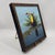 Original painting featuring a colorful toucan perched among lush tropical foliage against a soft blue background. The...