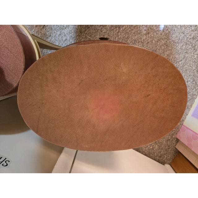 A pair of Grosfeld House two tier end tables. They are the definition of 1940's Hollywood Glam. There are some peeling due...