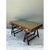 This campaign desk embodies the utilitarian elegance long associated with military-inspired furniture design, its...