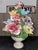 Capodimonte: A floral composition in slipware, featuring polychrome flowers in relief, with delicate shapes and soft,...
