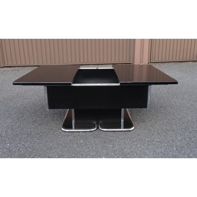 Vintage Italian Chrome and Black Ebonised Wooden Coffee Table with Hidden Bar, 1970s, in Good conditions. Designed 1970 to...