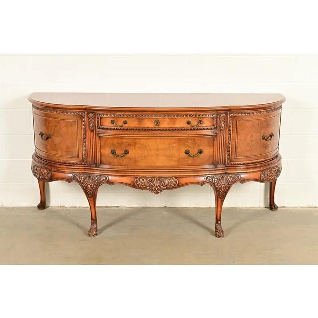 An exceptional antique Georgian or Chippendale style bow front sideboard, credenza, or bar cabinet By Berkey & Gay USA,...