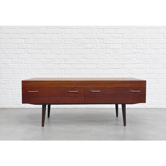 Mid Century Modern Rosewood Low Height Credenza, Made in Denmark, c. 1960’s. Its distinctive low profile and compact...