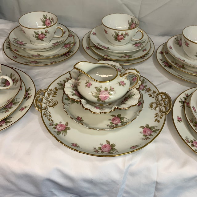 The dinnerware offered here is an antique GDA Limoges fine porcelain luncheon tea set featuring a classic pink rose motif...