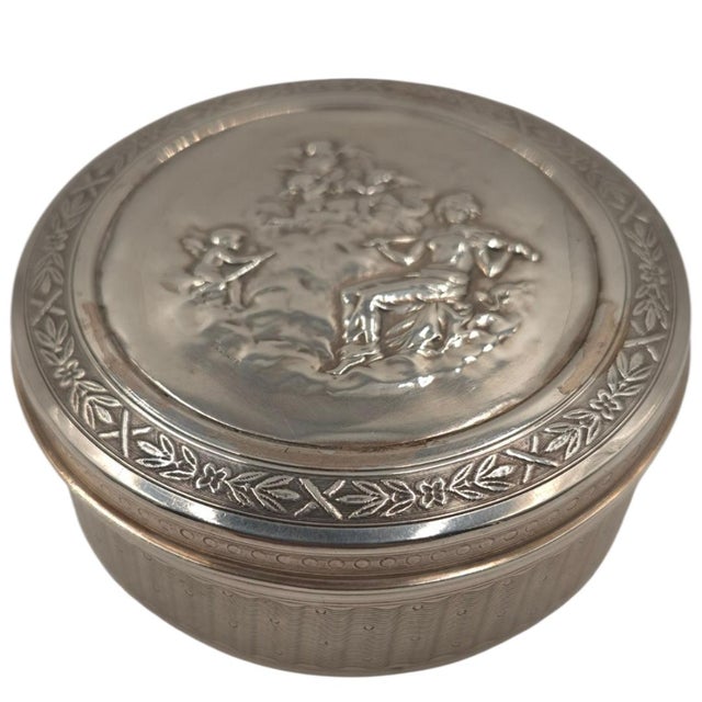 Add a touch of classical elegance to your vanity or collection with this exquisite round silver trinket box signed by...