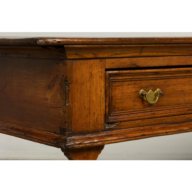 Late 18th-century English country pine dresser base or server, sourced in Paris, France. Crafted from solid pine, the...