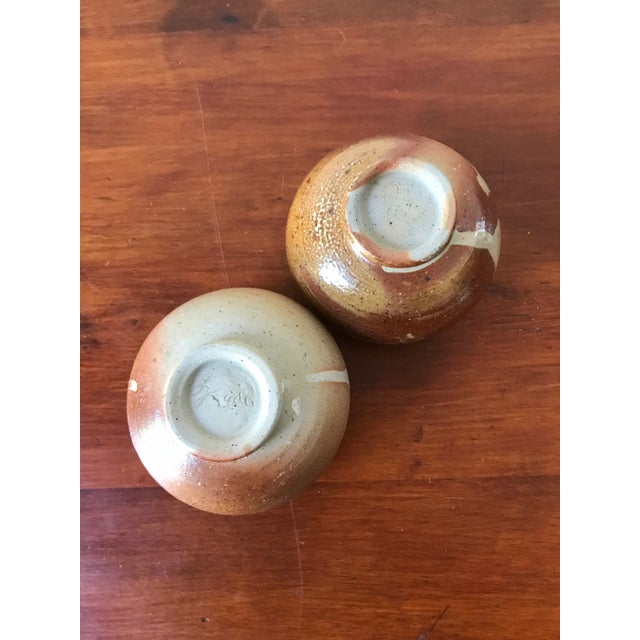 We love the earthy rustic look of this duo. Originally tea cups, we think they would be fun for salt and pepper. Signed on...