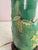 This gorgeous green glazed table lamp has a raised flower design with leaves and vines. Attached is a wooden base and...