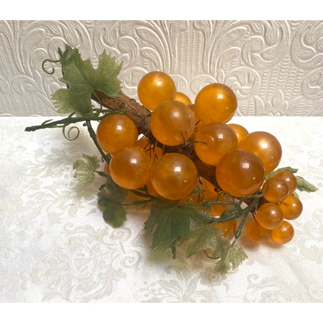 A fabulous vintage 1960’s large lucite grape cluster in fall colors!