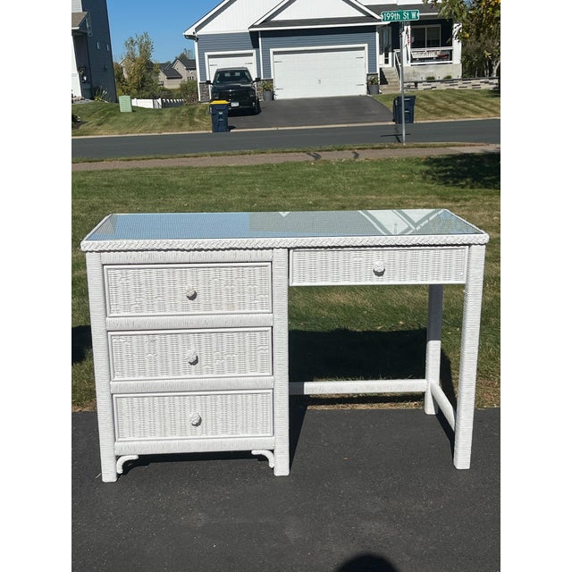 Elevate your home office, bedroom, or vanity space with this classic vintage Henry Link white wicker writing desk. A...