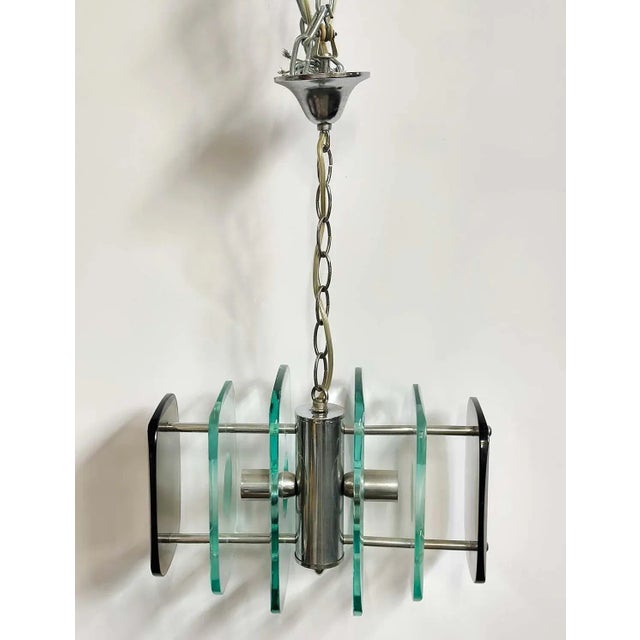 Vintage Italian pendant with clear and smoky Murano glass and chrome frame. Made in Italy, c. 1960's. Dimensions: 10"H x...