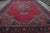 Made with hand-knotted wool and originating in the early 20th century, this 15x22 antique Persian rug is a rare and...