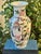 This porcelain chinoiserie vase is hand painted and made for export in the late 20th century. It stands 10” tall and...