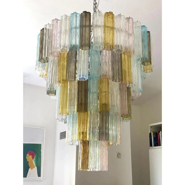 Huge multicolor murano glass “tronchi”chandelier. 5levels of opalino "tronchi" murano glass: amber, fumè, light-blue and...