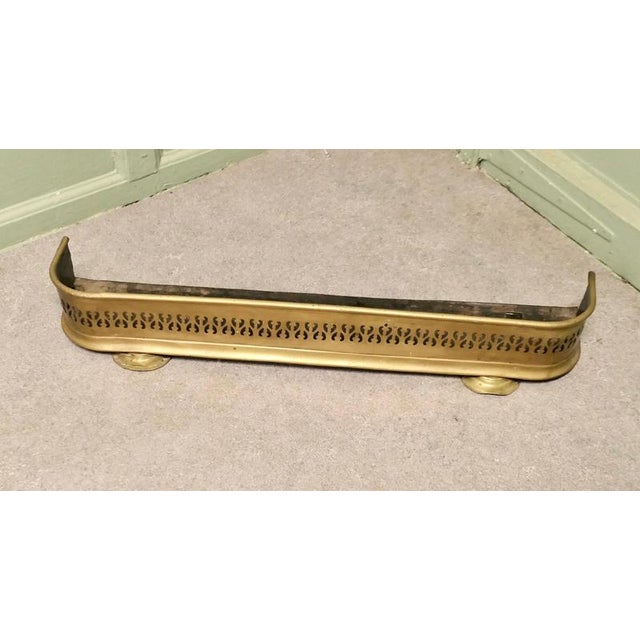 Small Victorian Pierced Brass Fender This is a Victorian Pierced Brass Fender, it stands on small feet at the front which...