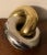 Mid-Century Modern brass and chrome knot sculpture constructed of two interlocking rings. Measures 10 1/2" long x 7 1/2"...