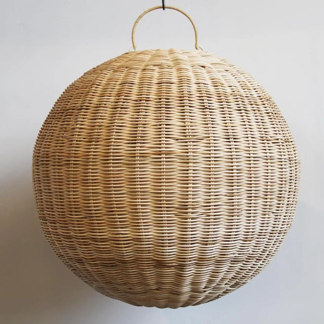 Hand woven raw natural rattan globe pendant lantern. Indoor use suggested, outdoor under cover. Each lantern will have...