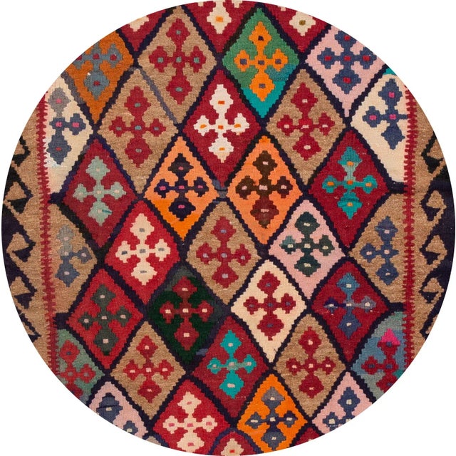 A beautiful hand-woven vintage Kilim runner with an all-over multi-color geometric design. This rug measures 5' 1" x 13'.