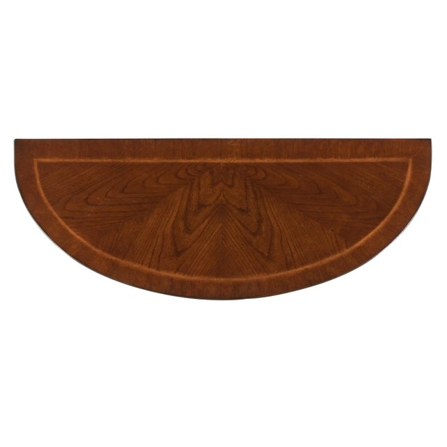 With simple lines, traditional styling and demilune shape, this elegant console table will enhance your space for years to...