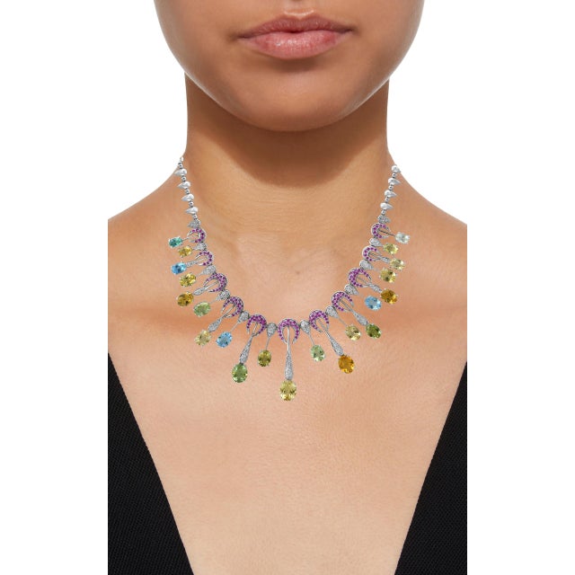 25 Carat Oval natural Aquamarine of different color & 3 Carat Diamonds Necklace 18 K White Gold This extraordinary...