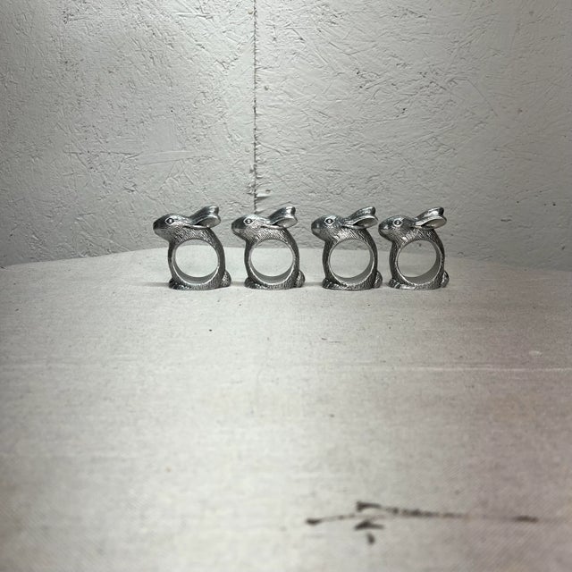 Set of 4 Hans Turnwald rabbit napkin rings. Includes original box. Measures 2.5” w x 1.25” d x 2.5” h.