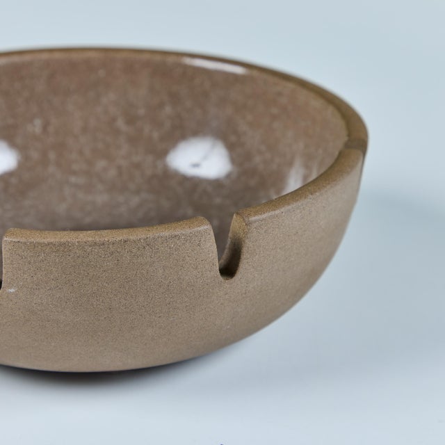 Ceramic ashtray by Heath Ceramics, c.1960s, USA. The ashtray features a stoneware exterior and tan speckle glazed interior...