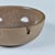 Ceramic ashtray by Heath Ceramics, c.1960s, USA. The ashtray features a stoneware exterior and tan speckle glazed interior...