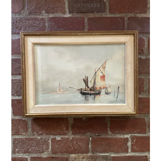 This is an antique framed watercolor painting of Venetian fishing boats (bragozzi) by Maybelle Bayley Copp. Her monogram,...
