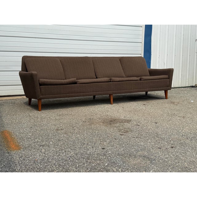 Exceptional mid-century Danish Modern four-seat sofa designed by Folke Ohlsson for DUX. This generously proportioned sofa...