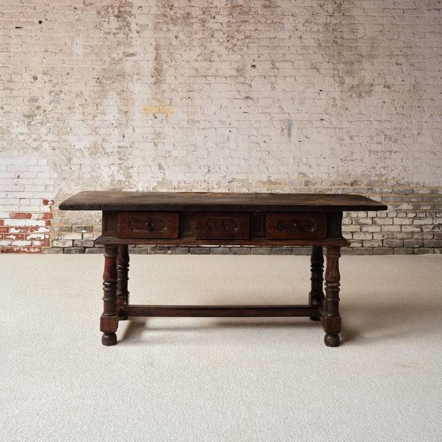 Introduce true Old World character into your home with this 17th century French oak and walnut console table, an...