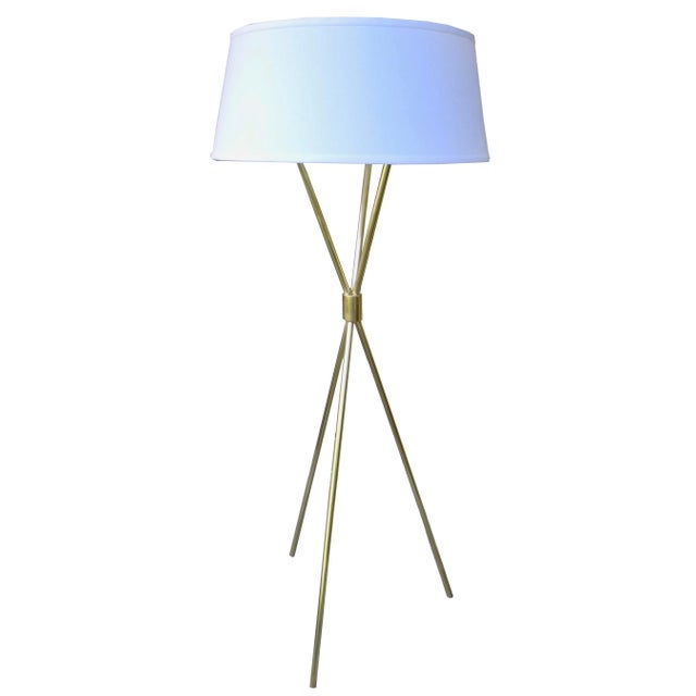 This solid brass floor lamp designed by TH Robsjohn Gibbings for Hansen Lighting is rewired and restored with a new linen...