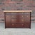 Fully refinished cork top credenza with brass X pulls by Paul Frankl for Johnson Furniture.