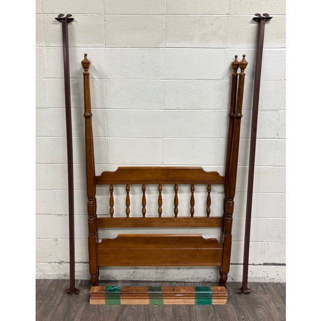 This is a rare and beautiful vintage Heywood-Wakefield Old Colony twin-size four-poster bed in the original Cinnamon maple...