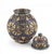 DESIGN & EDITORIAL NARRATIVE This striking Moroccan lidded jar masterfully blends hand-shaped potterywith intricate metal...