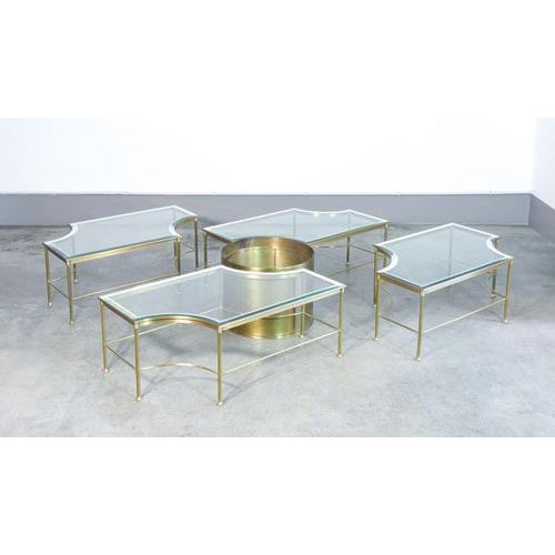 Hollywood regency modular low coffee table set with a central plant stand, made of brass and glass. 1970s period 1970s...