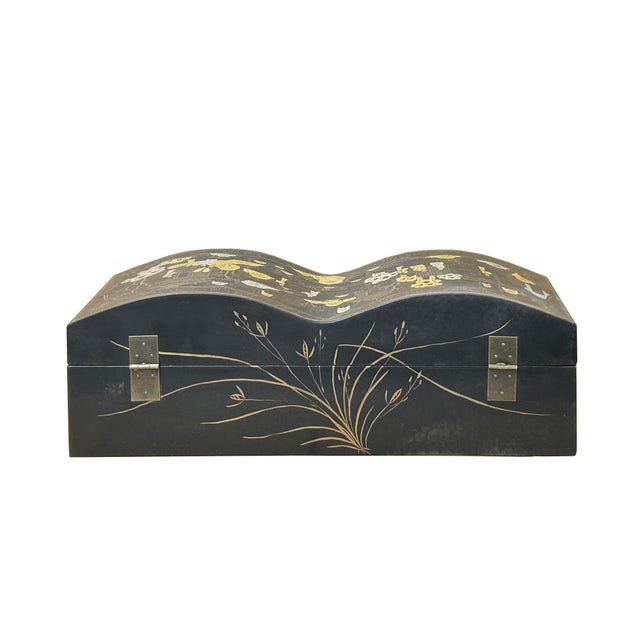 This elegant, rectangular lacquer box is defined by its striking double-arched lid, which creates a sinuous, wave-like...