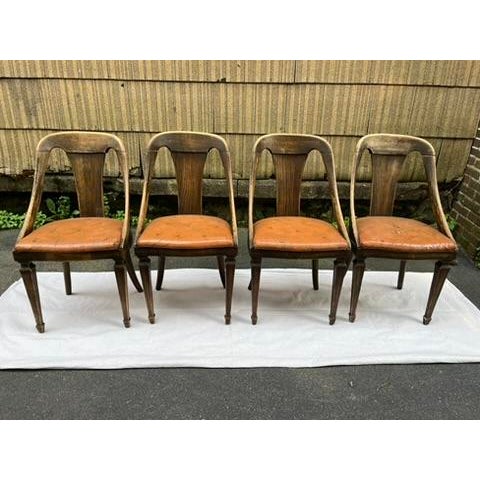 A set of four matching oak dining chairs by Jack Van der Molen for Jamestown Lounge Co. Each chair features a solid oak...